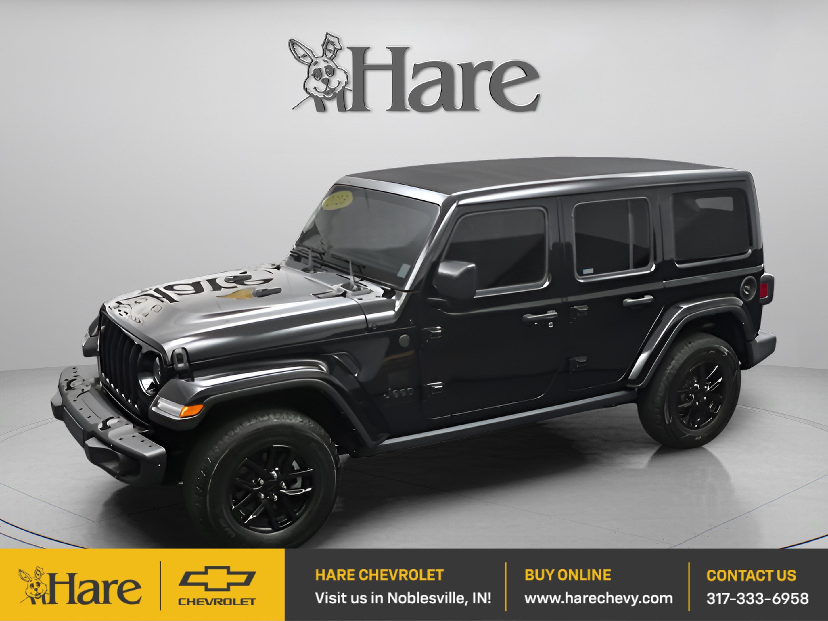 2023 Jeep Wrangler 4-Door Freedom 4x4 in Black — front three-quarter view