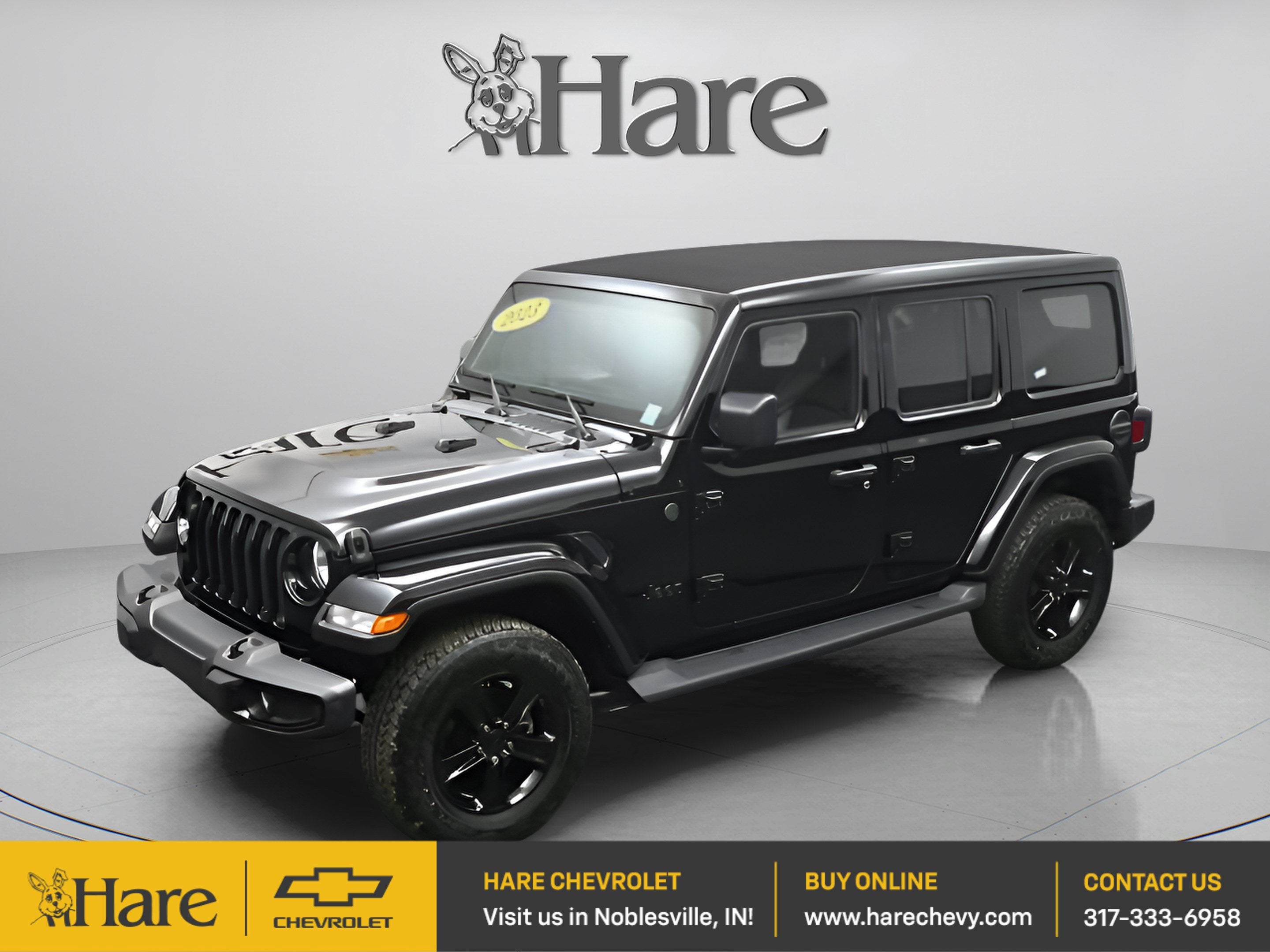 2023 Jeep Wrangler 4-Door Sahara Altitude 4x4 in Black — front three-quarter view