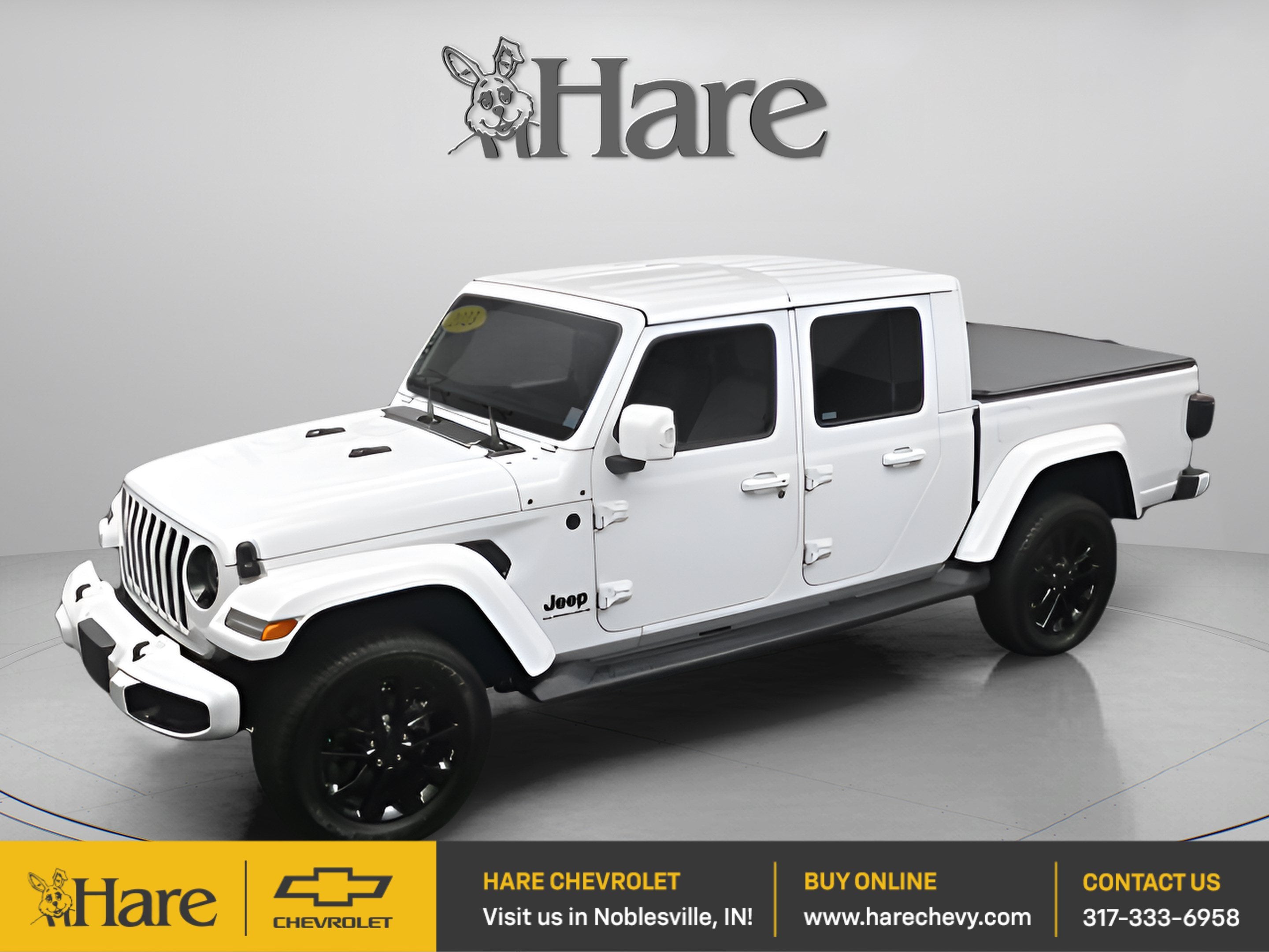 2023 Jeep Gladiator High Altitude 4x4 in White — front three-quarter view