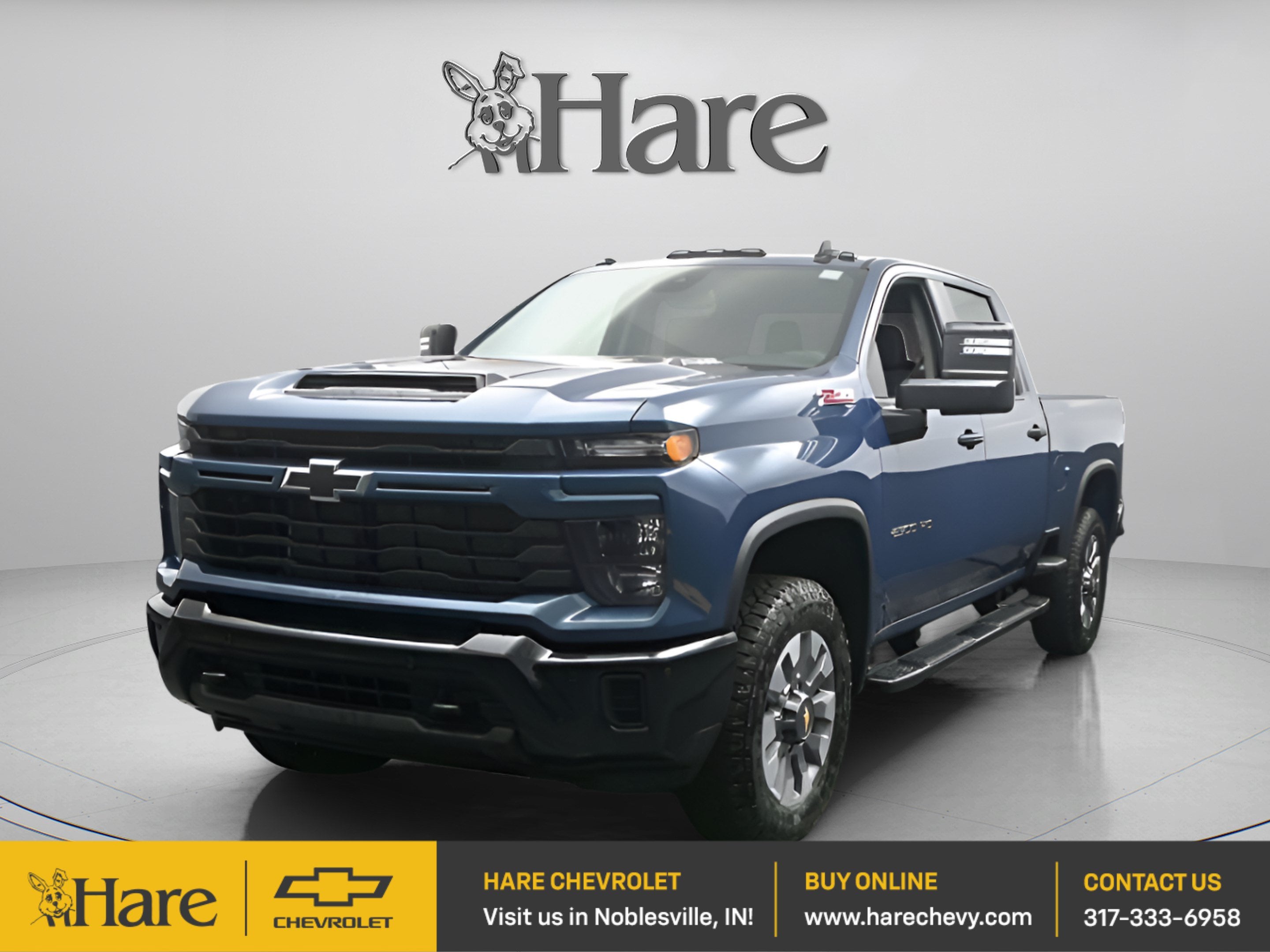 2026 Chevrolet Silverado 2500 HD Custom in Lakeshore Blue Metallic — front three-quarter view