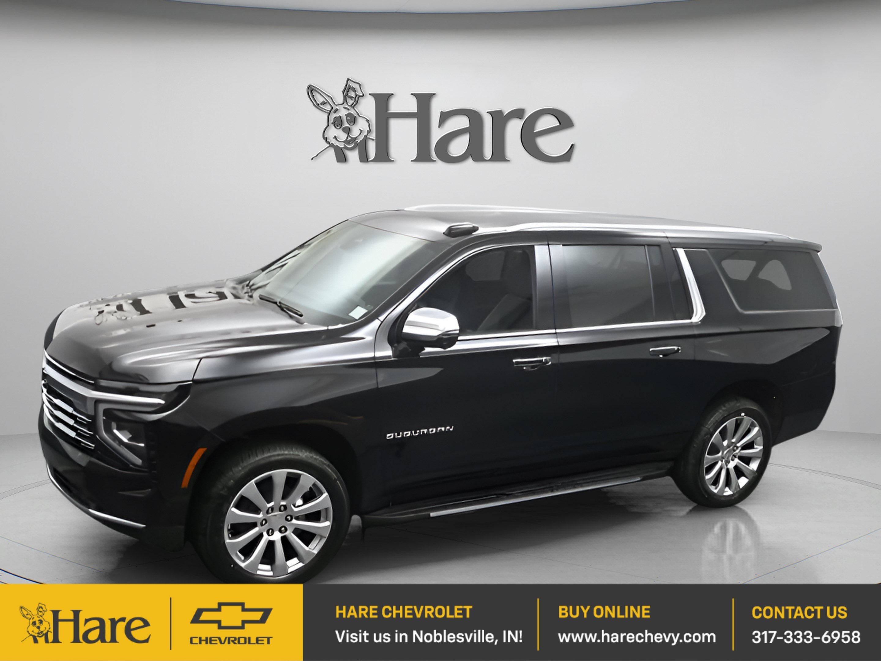 2026 Chevrolet Suburban Premier in Black — front three-quarter view