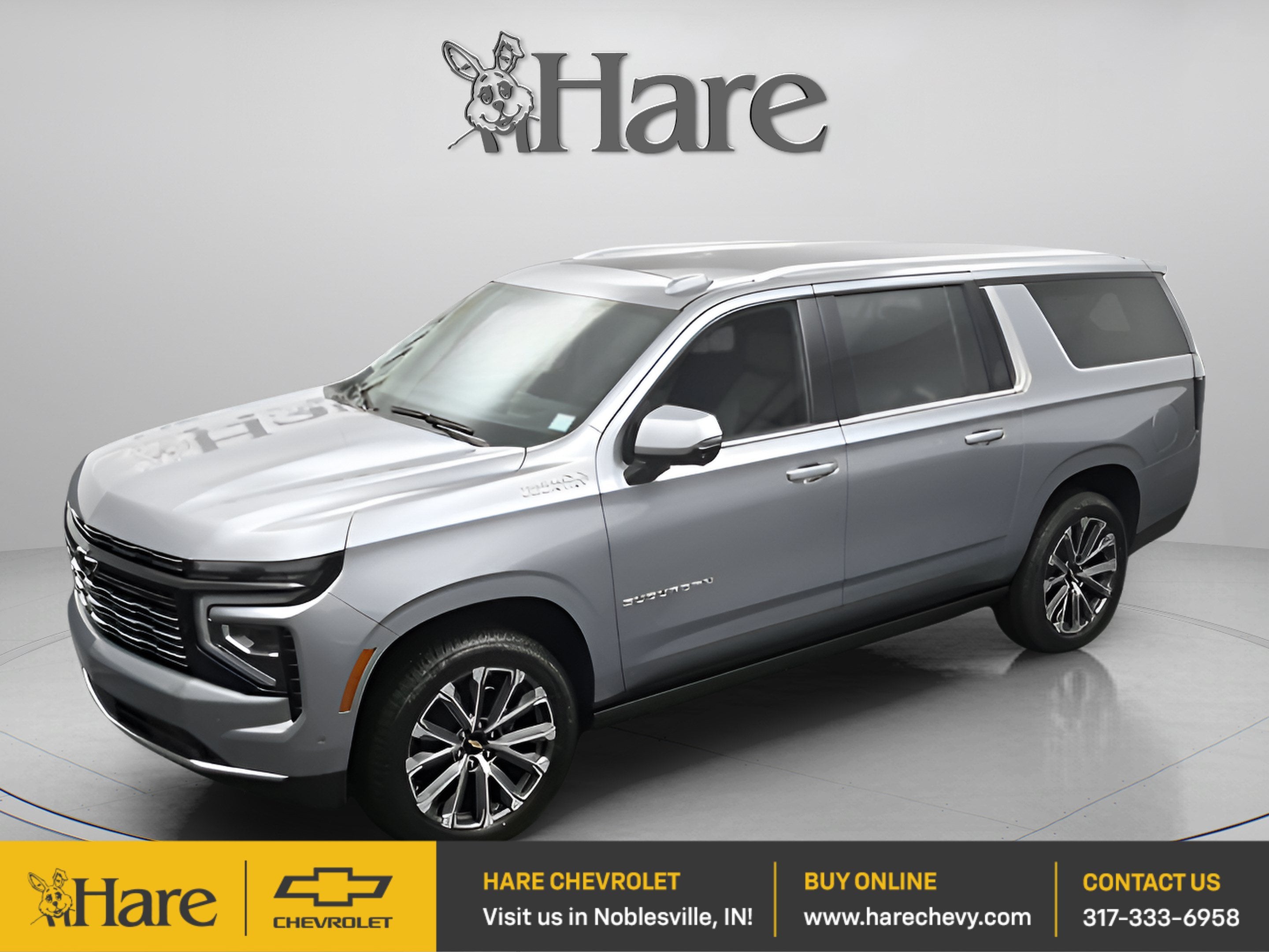 2026 Chevrolet Suburban High Country in Sterling Gray Metallic — front three-quarter view
