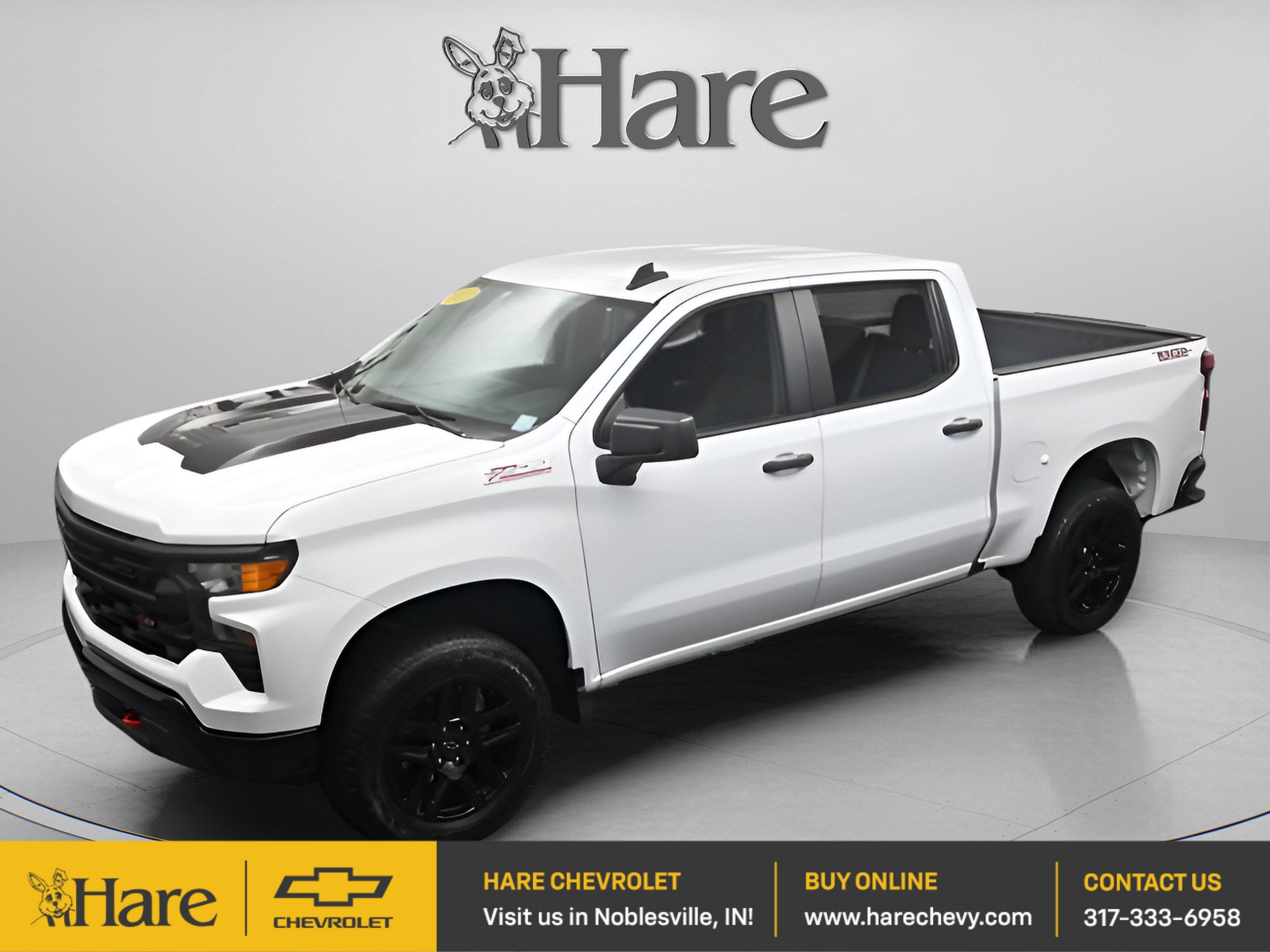 2023 Chevrolet Silverado 1500 Custom Trail Boss in Summit White — front three-quarter view