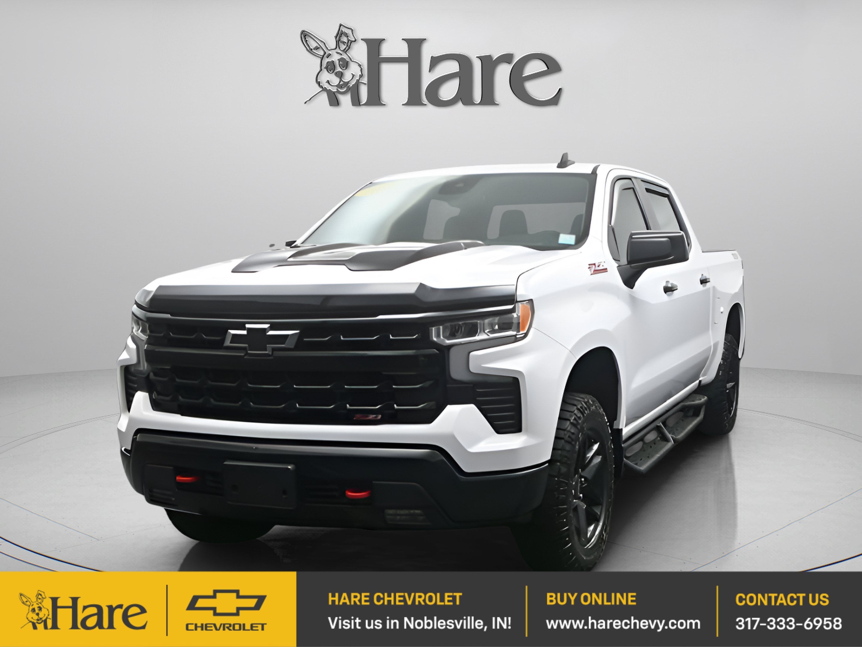 2023 Chevrolet Silverado 1500 LT Trail Boss in Summit White — front three-quarter view
