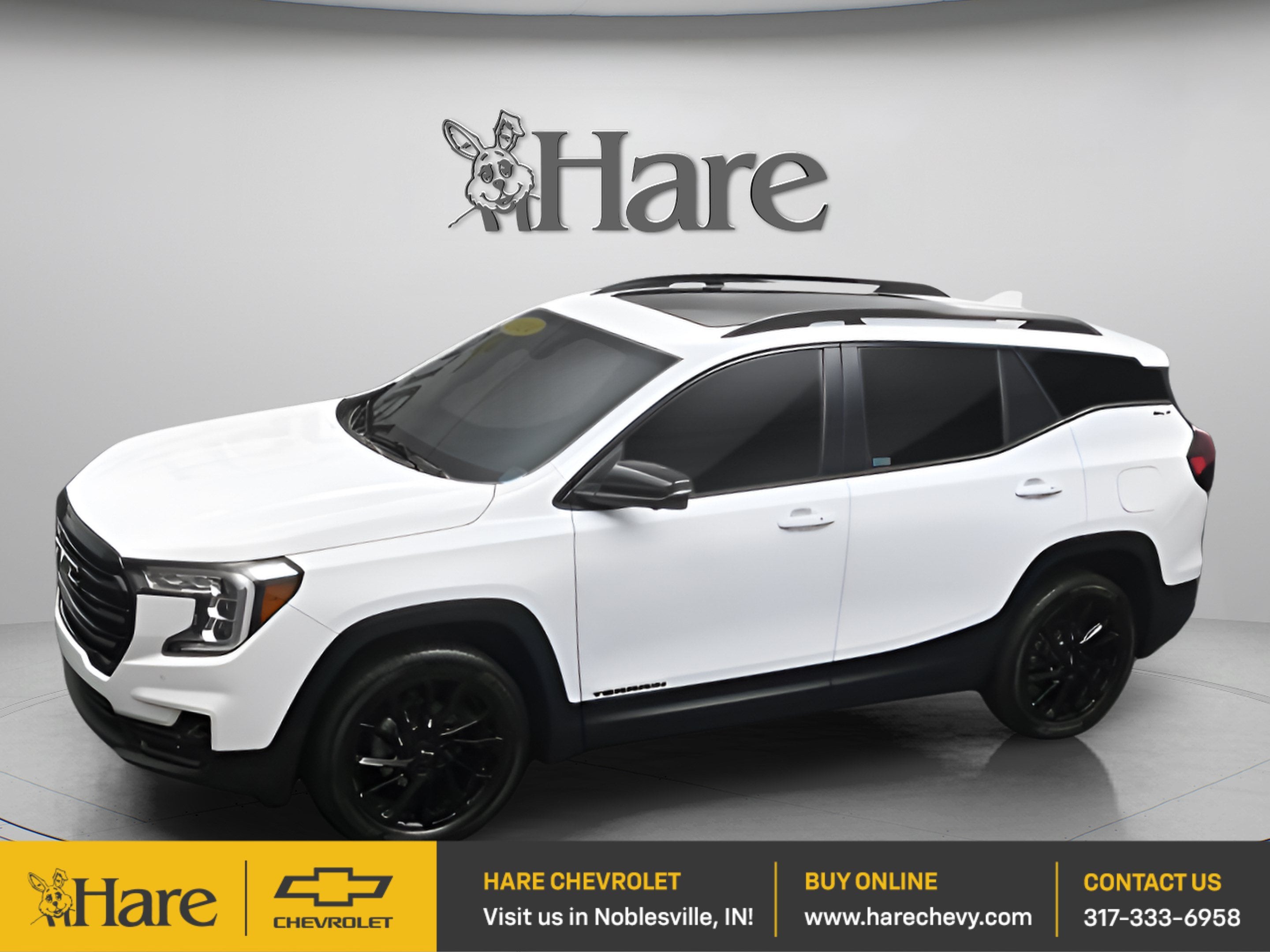 2024 GMC Terrain SLT in Summit White — front three-quarter view