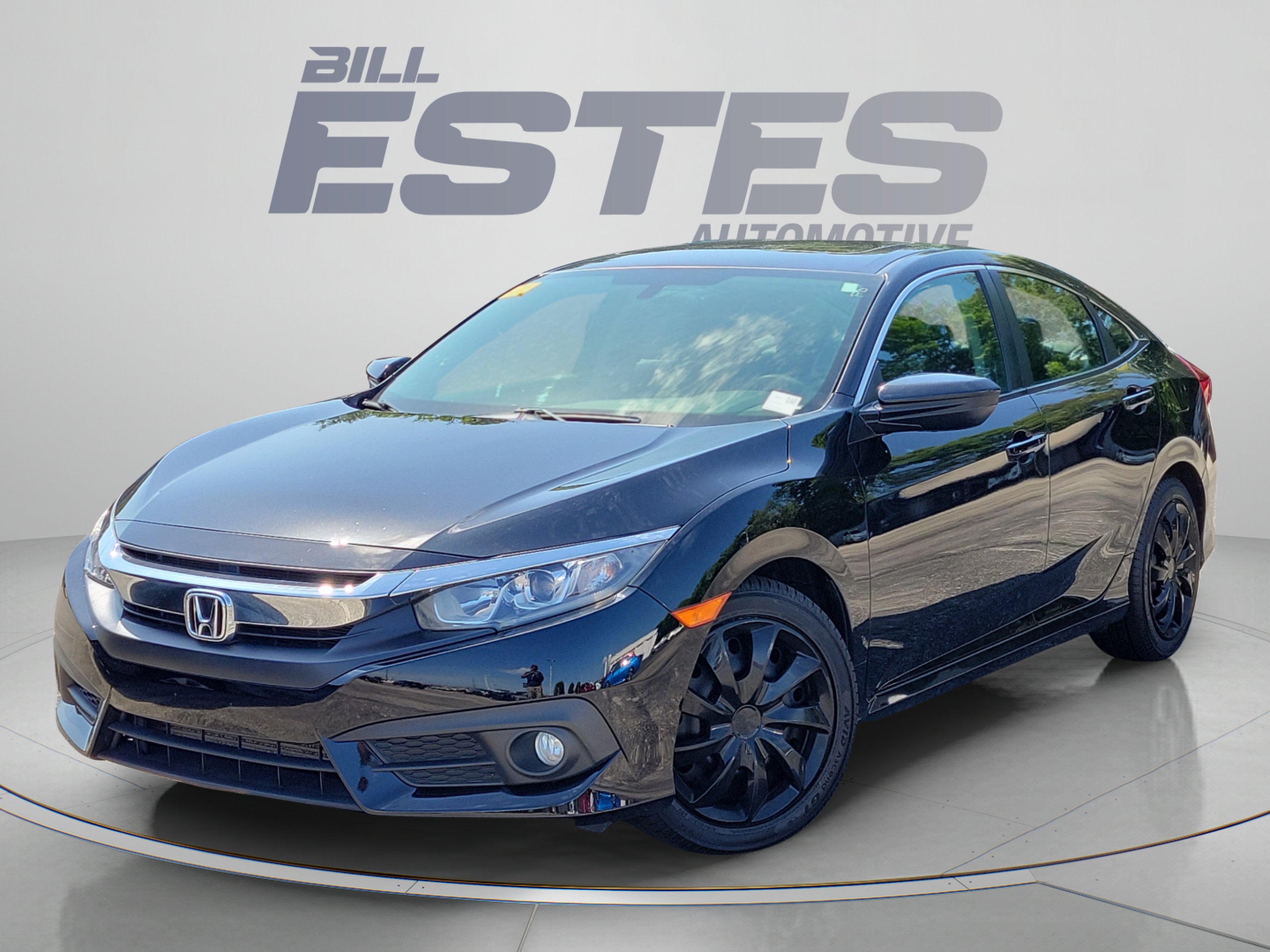 2017 Honda Civic Sedan EX-T in Crystal Black Pearl — front three-quarter view