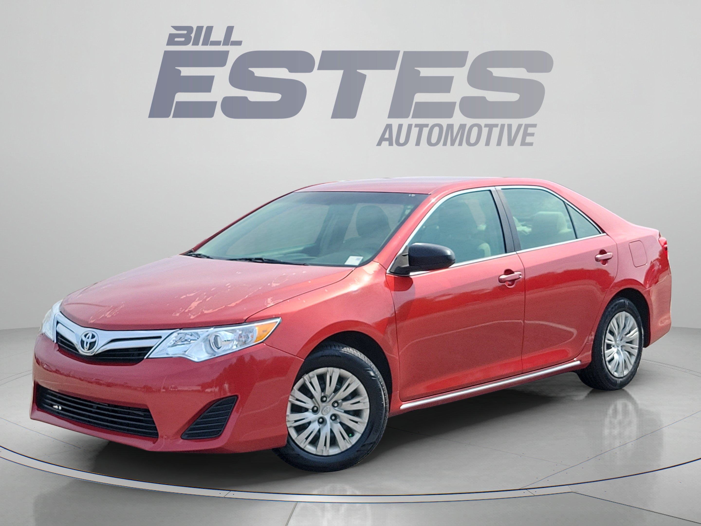 2012 Toyota Camry LE in Barcelona Red Metallic — front three-quarter view