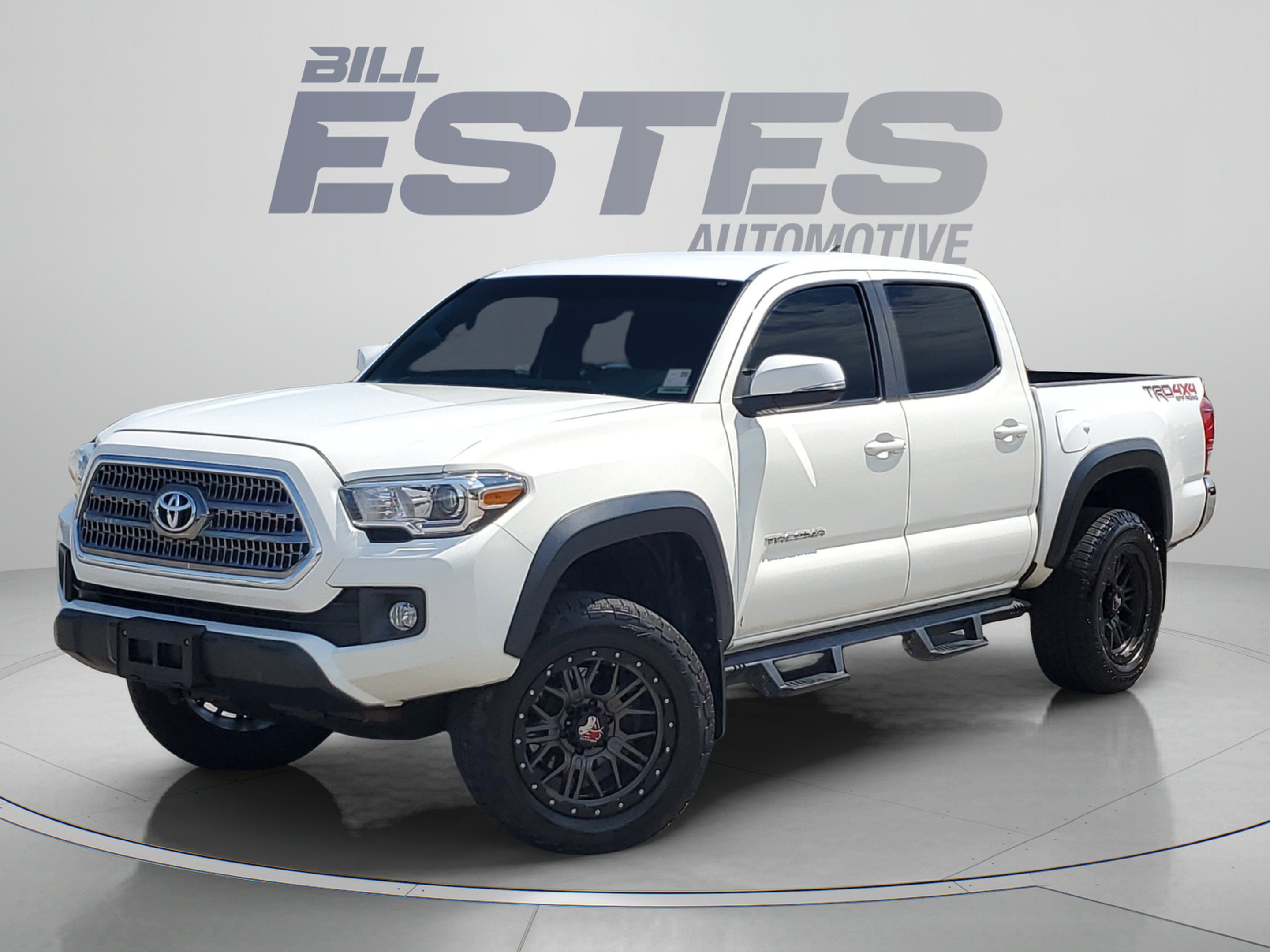 2016 Toyota Tacoma TRD Off-Road in Super White — front three-quarter view