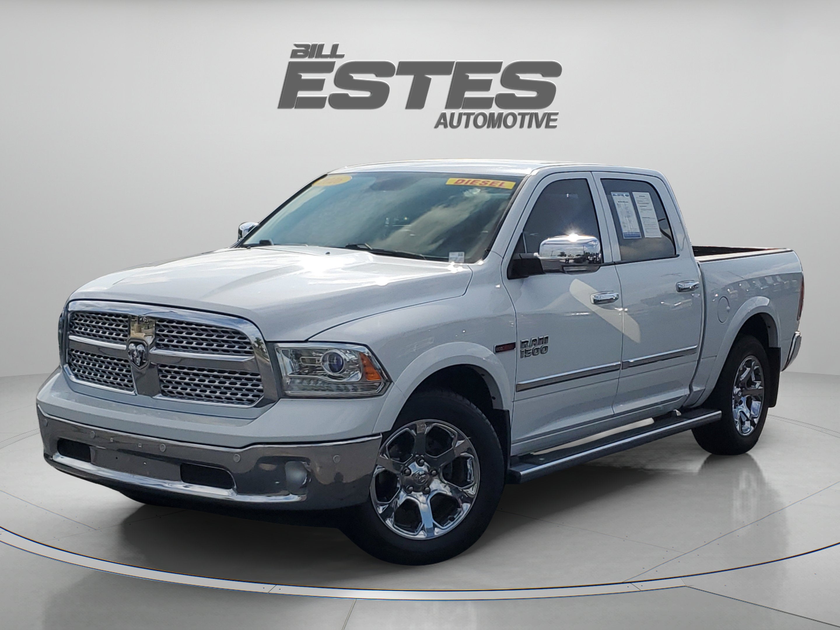 2016 RAM 1500 Laramie in Bright White Clearcoat — front three-quarter view