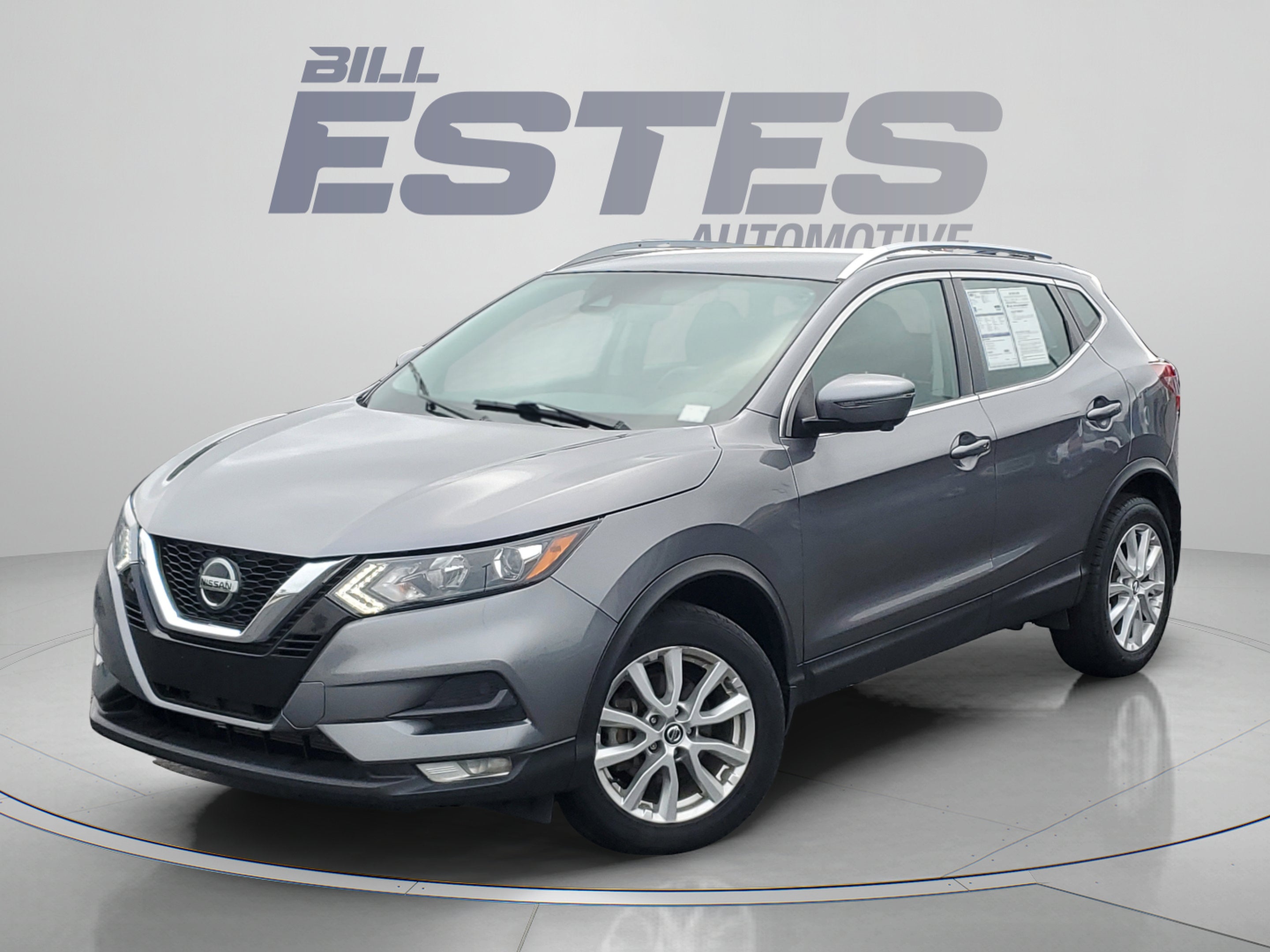 2022 Nissan Rogue Sport SV in Gun Metallic — front three-quarter view