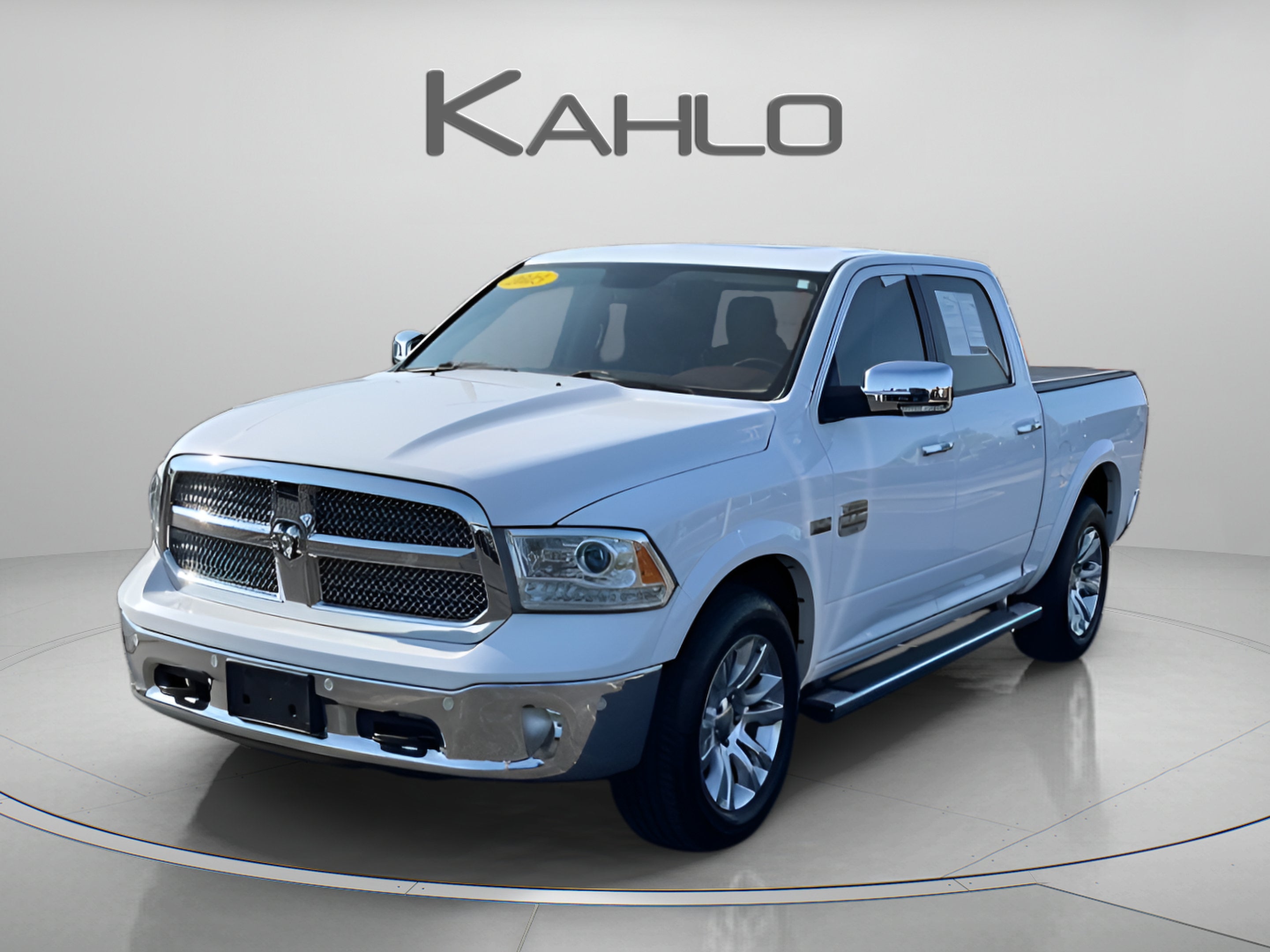 2015 RAM 1500 Laramie Longhorn in Bright White Clearcoat — front three-quarter view