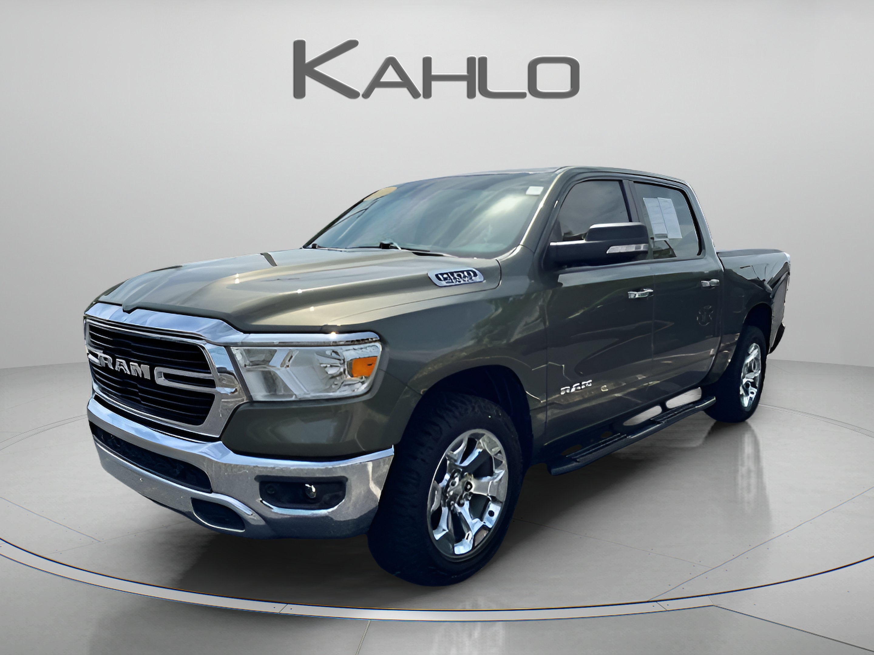 2020 RAM 1500 Big Horn in Olive Green Pearlcoat — front three-quarter view