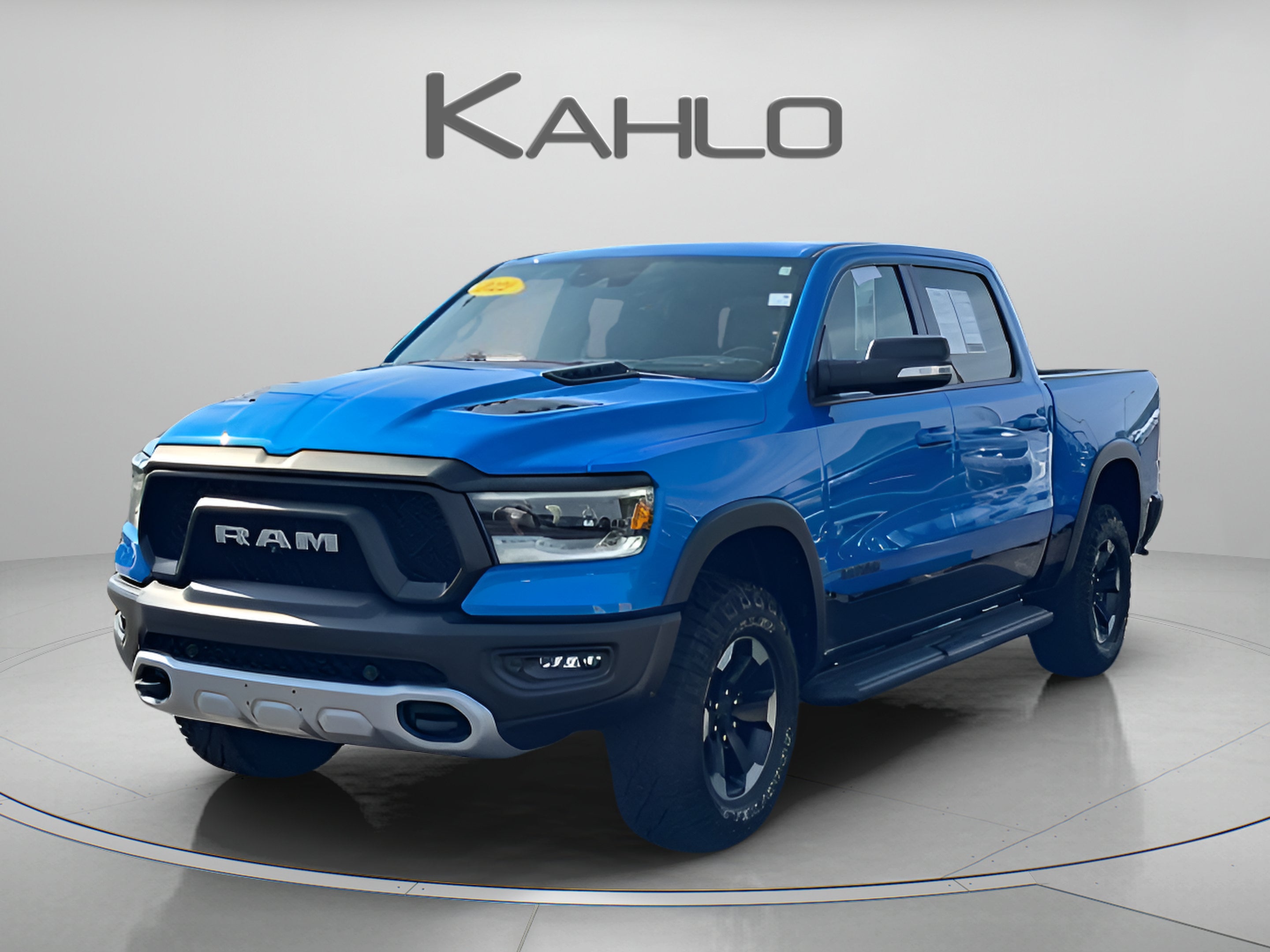 2022 RAM 1500 Rebel in Hydro Blue Pearlcoat — front three-quarter view