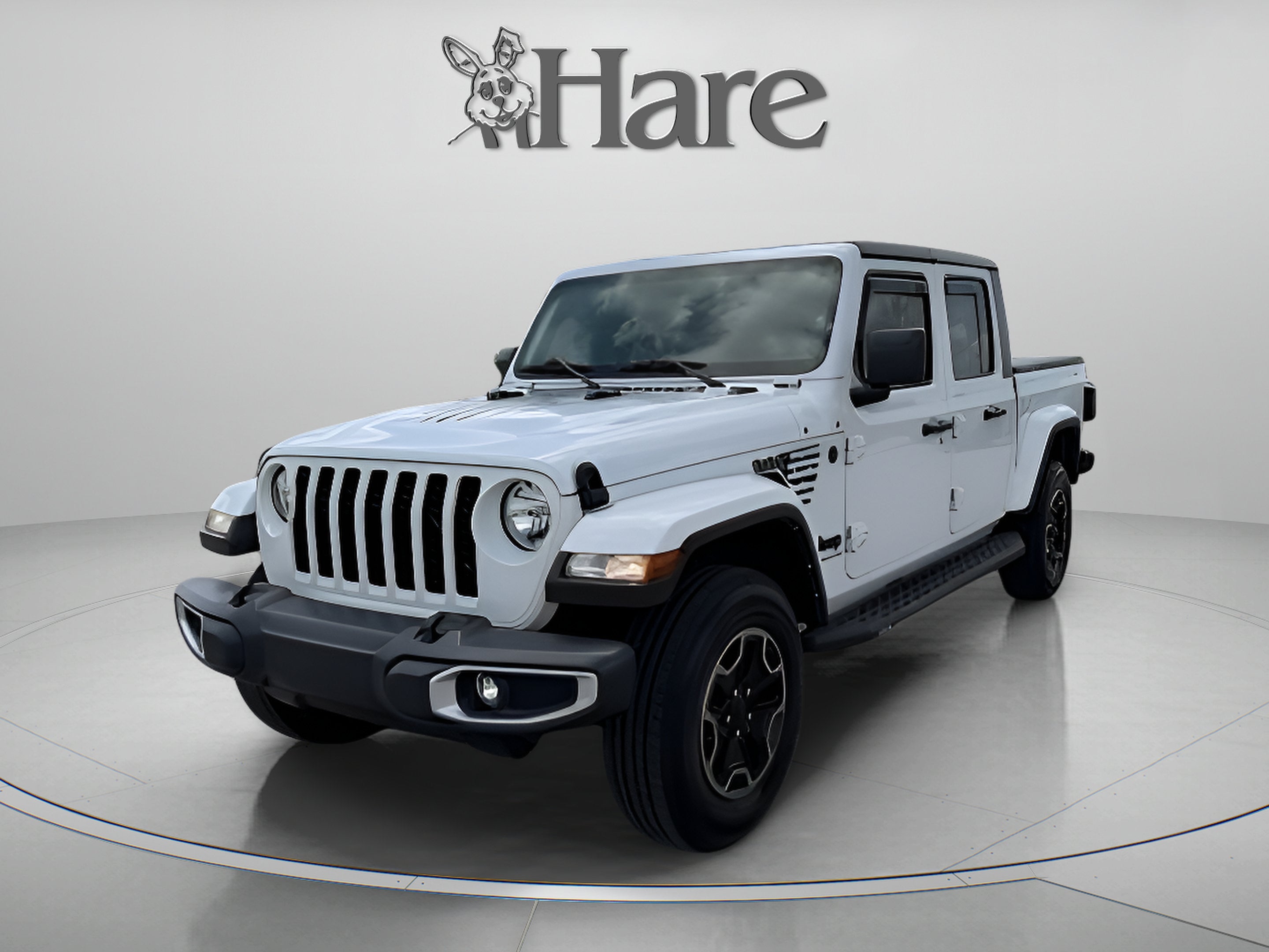 2022 Jeep Gladiator Sport S in Bright White Clearcoat — front three-quarter view
