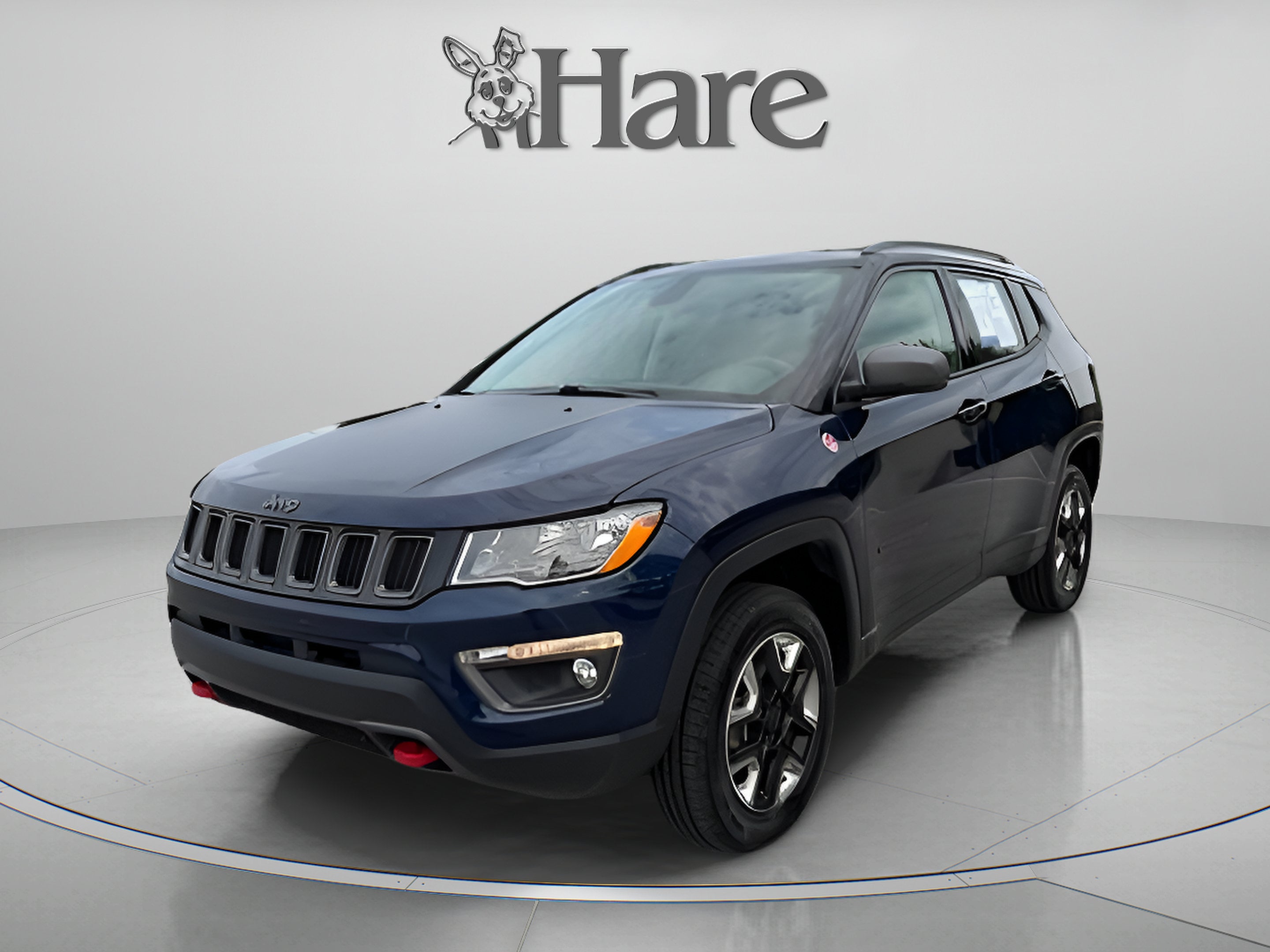 2018 Jeep Compass Trailhawk in Jazz Blue Pearlcoat — front three-quarter view