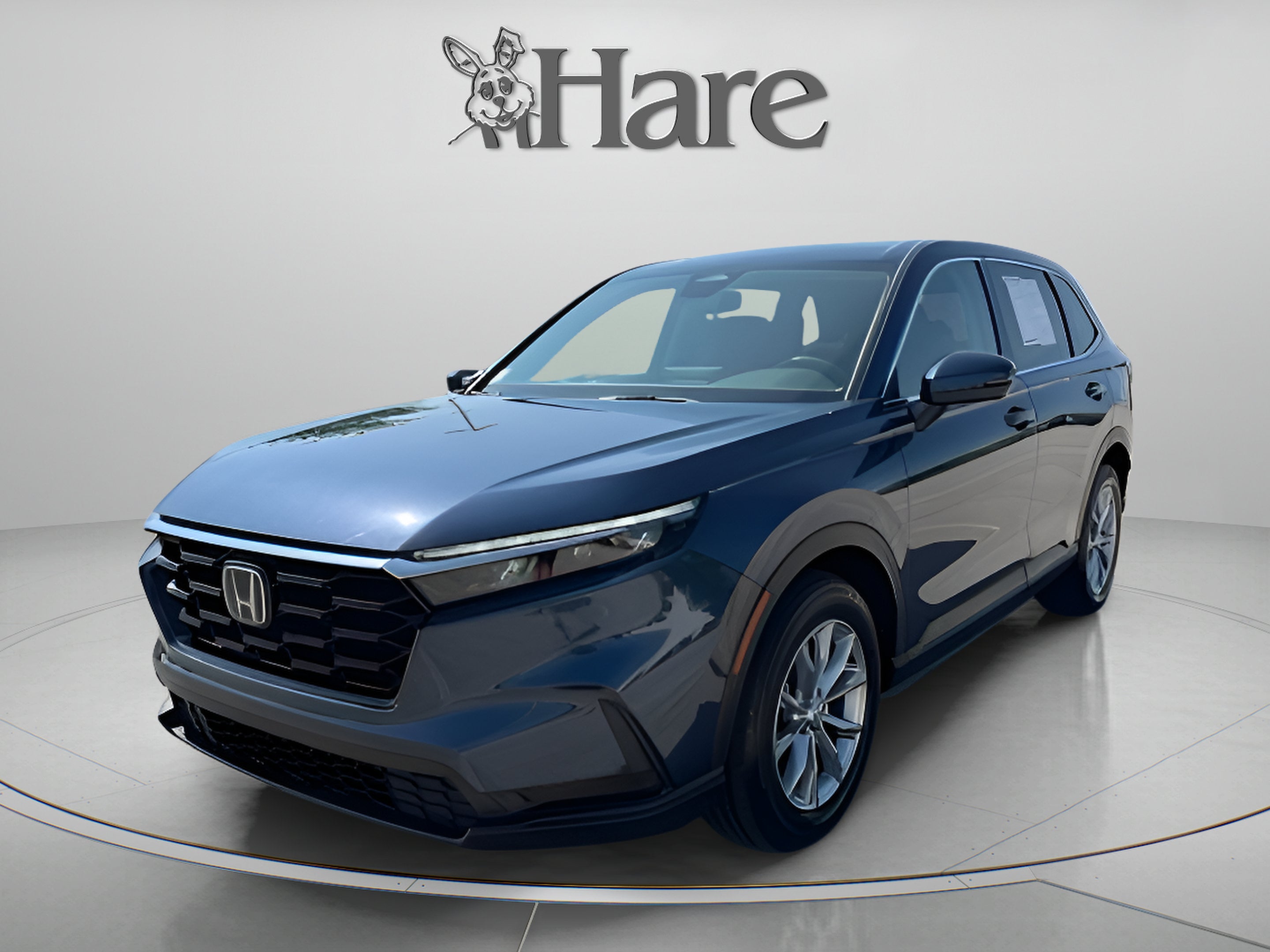 2024 Honda CR-V EX in Canyon River Blue Metallic — front three-quarter view