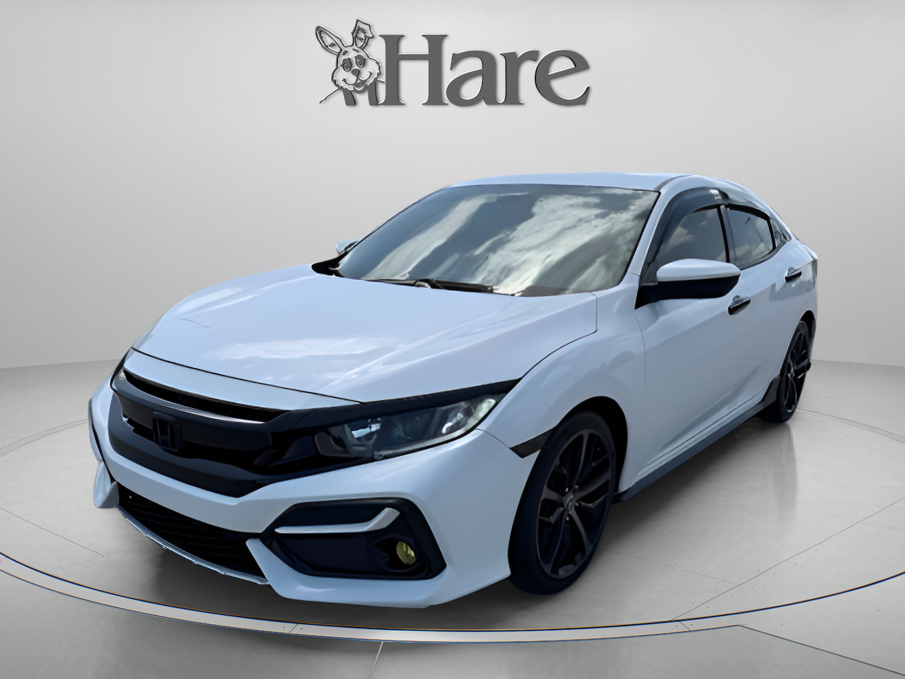 2021 Honda Civic Hatchback Sport in Platinum White Pearl — front three-quarter view